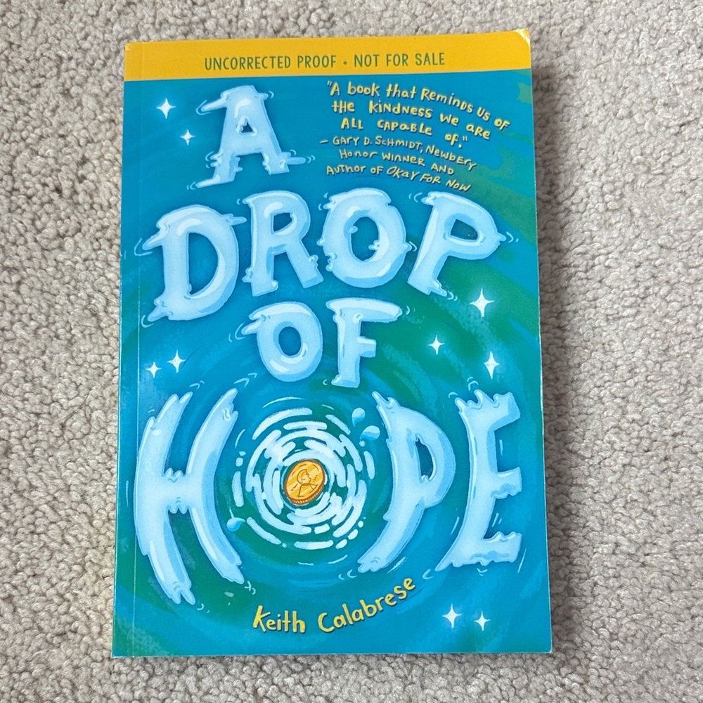 Scholastic Blue and Yellow "A Drop of Hope" Kids Book